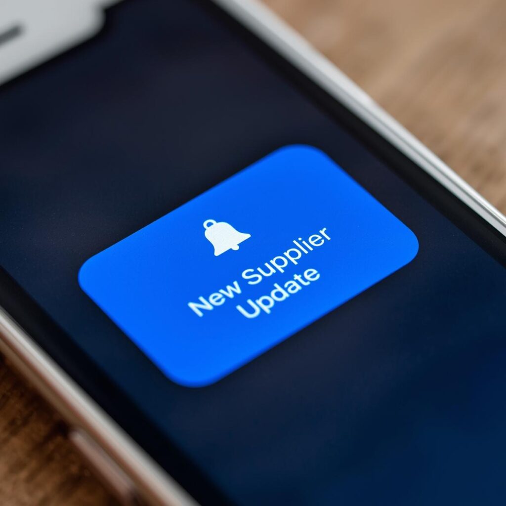 Mobile phone showing a notification that states "New Supplier Update".